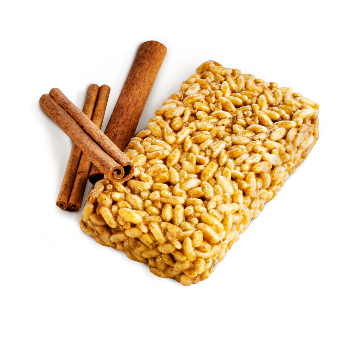 Wild Fox Foods Cinnamon Churro Protein Bar with cinnamon sticks on a white background