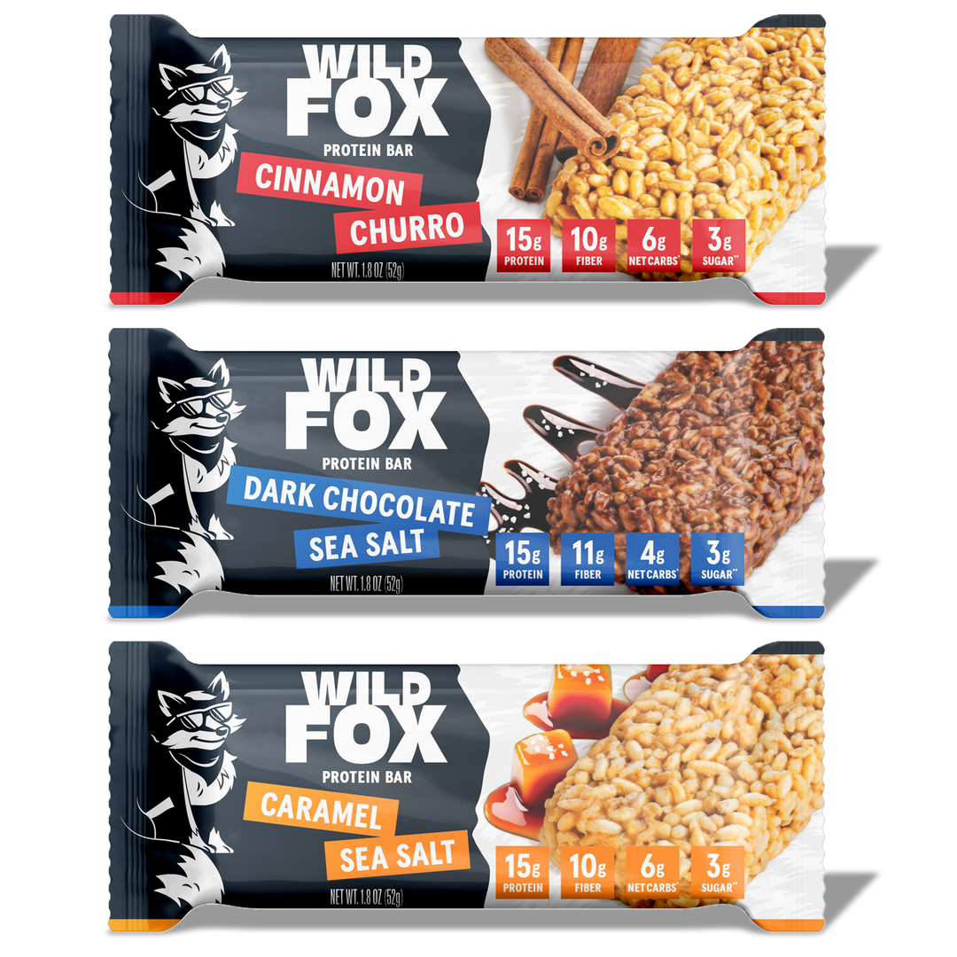 Three Wild Fox protein bars with different flavors on a white background