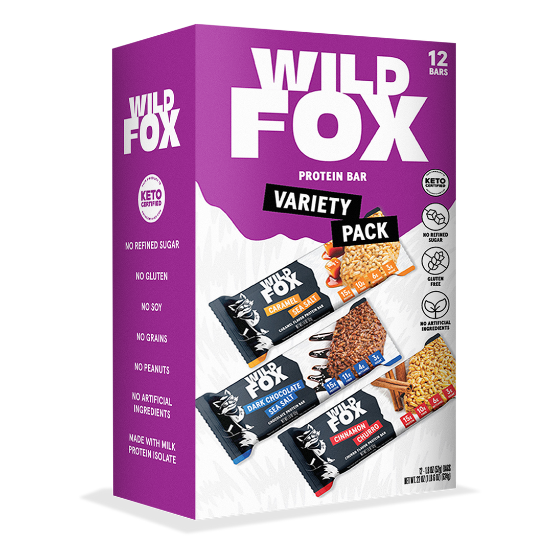 Box of Wild Fox protein bars variety pack with a purple background